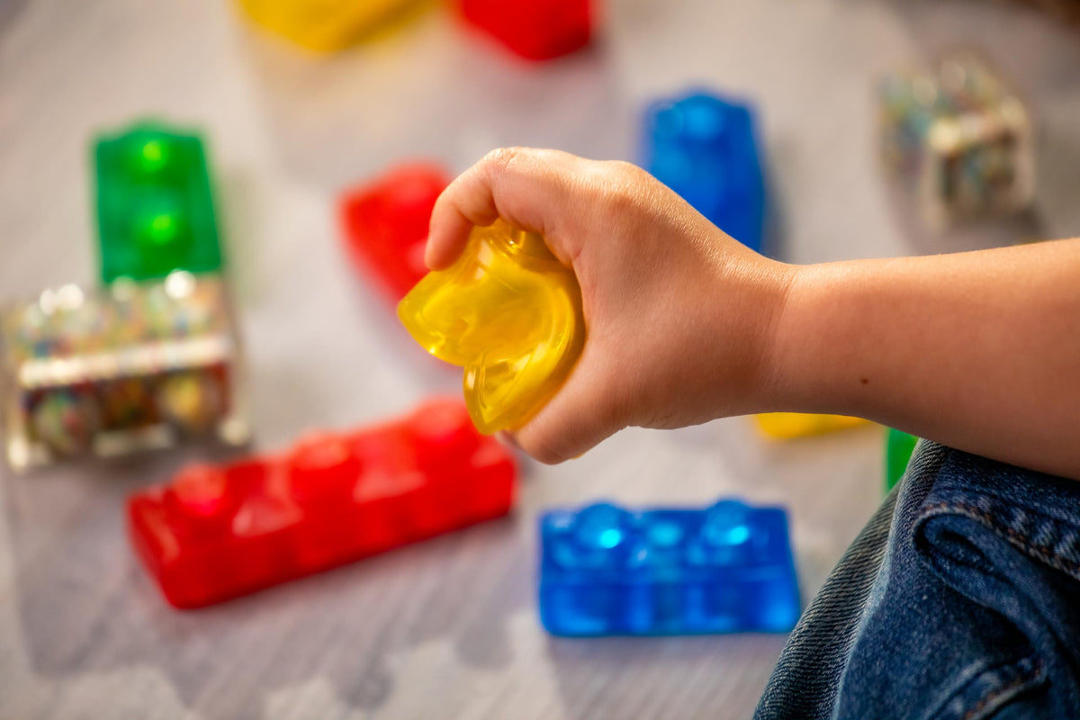Jelly Blox Stash 'N Stack 2-in-1 Storage Case with 30 Blocks | Toddler & Preschool Building Blocks Kids Can Squeeze & Stretch | MESH ACCREDITED | Safety Tested & Ouch-Free | Sensory Play Toy Ages 2+